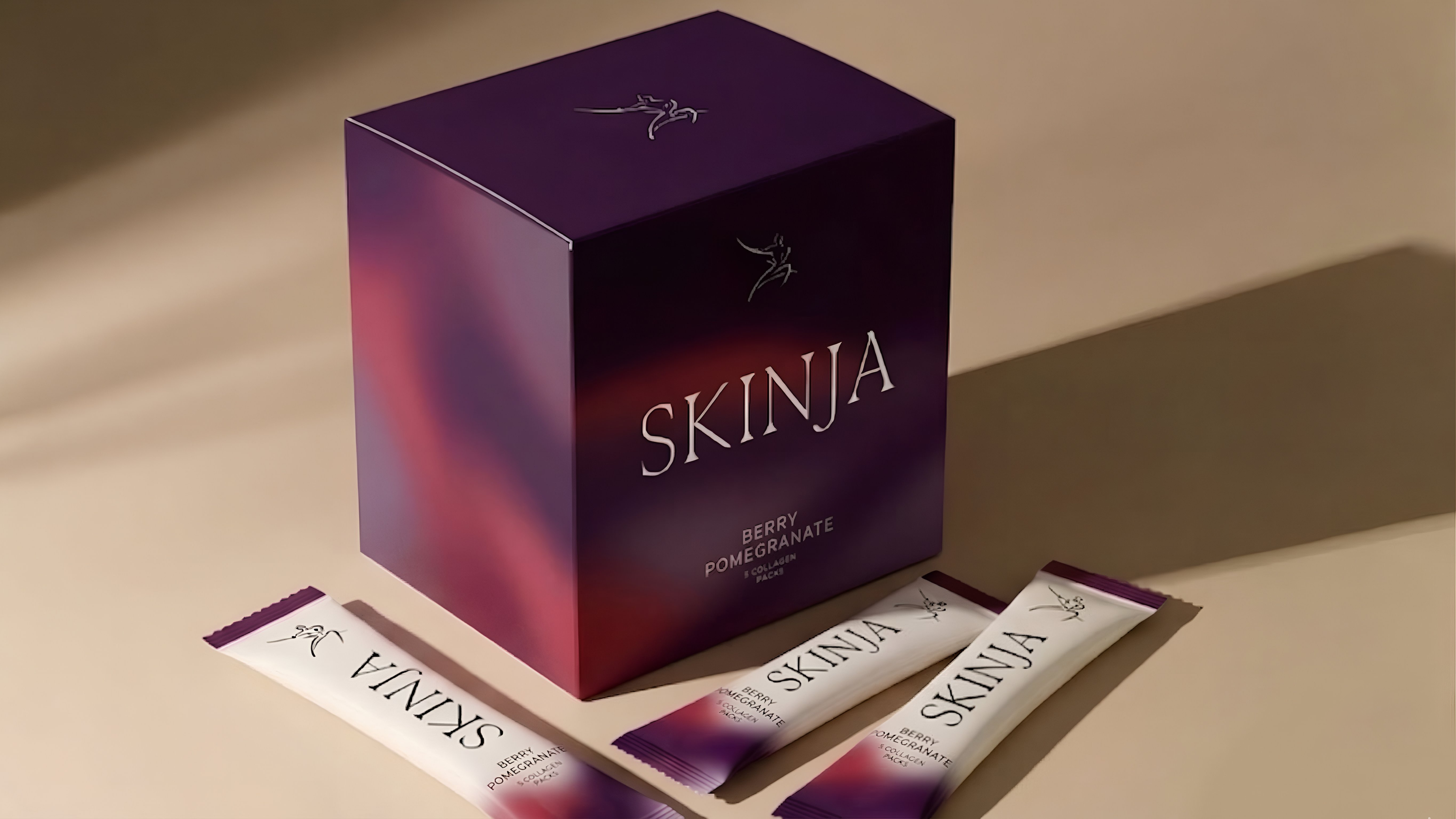 SKINJA product packaging on a beige background